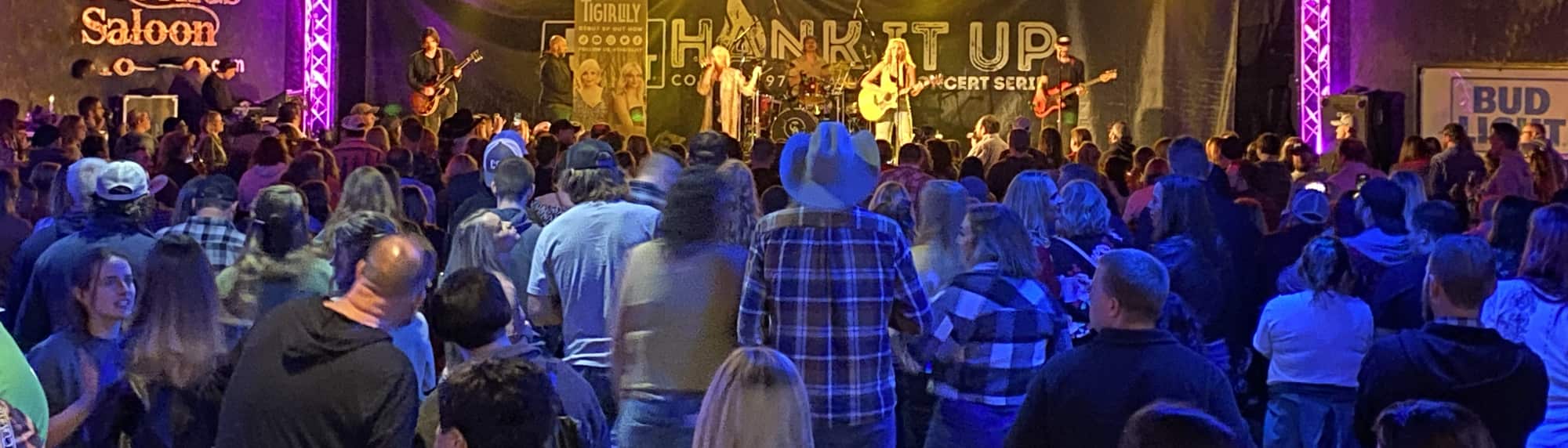 country concert with fans wearing cowboy hats Cheyenne