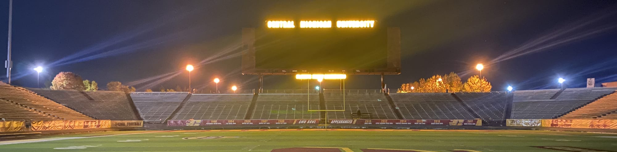 empty football stadium at night under the lights Cheyenne